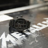 A black 51:30 watch Nixon designed in collaboration with the rock band Metallica.